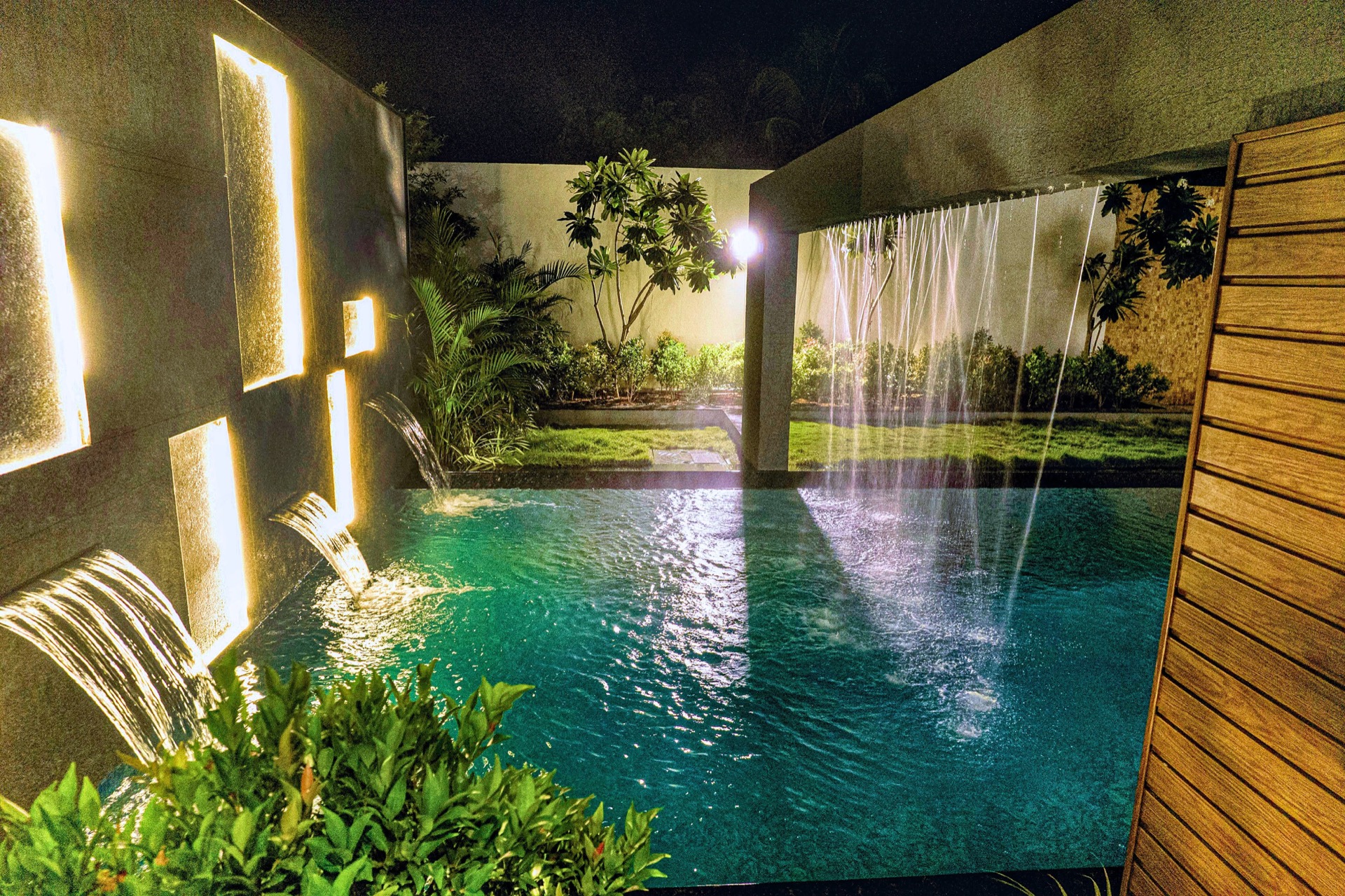 Lumina Beach Villa — waterfall feature at night